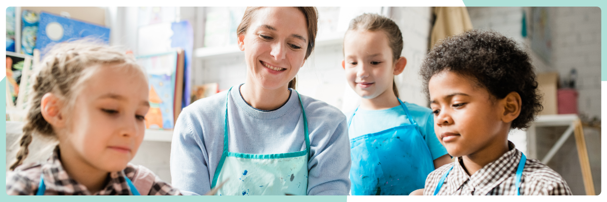 Children doing arts and crafts with teacher