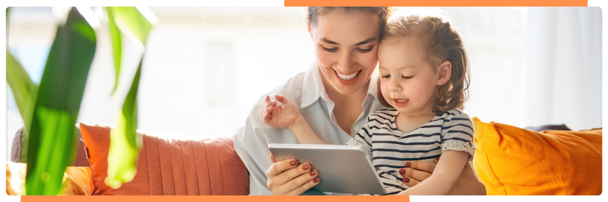 happy parent and child looking at childcare app